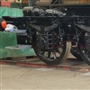 Tender chassis re-wheeled and now fitted with springs, with brake gear now in the process of being re-fitted and the spring buckles will be lined out with red lining. 