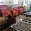 Volunteer George Bee annealing small boiler tubes